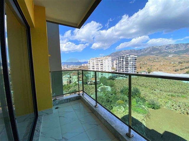 اطلالة على جبال طوروس - شقة غرفة وصالة - مجمع حديث - في محمودلار / الانيا 