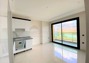 اطلالة على جبال طوروس - شقة غرفة وصالة - مجمع حديث - في محمودلار / الانيا 