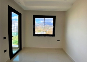 اطلالة على جبال طوروس - شقة غرفة وصالة - مجمع حديث - في محمودلار / الانيا 