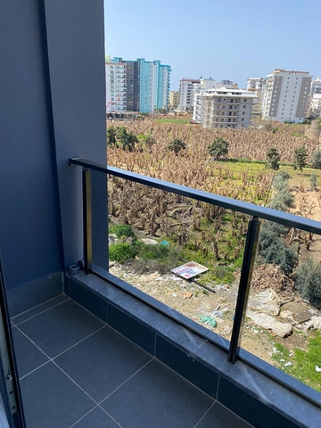 اطلالة مفتوحة - شقة غرفة وصالة جديدة -ضمن مجمع سكني - في محمودلار / الانيا 