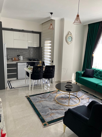 اطلالة مفتوحة - شقة غرفة وصالة جديدة -ضمن مجمع سكني - في محمودلار / الانيا 