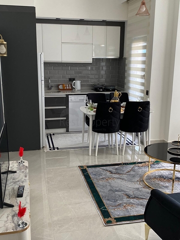 اطلالة مفتوحة - شقة غرفة وصالة جديدة -ضمن مجمع سكني - في محمودلار / الانيا 