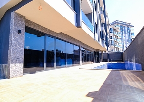 اطلالة مفتوحة - شقة غرفة وصالة جديدة -ضمن مجمع سكني - في محمودلار / الانيا 