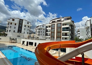 جانب المشفى الحكومي في الانيا - شقة 2 غرفة وصالة ضمن مجمع حديث في اوبا / الانيا 