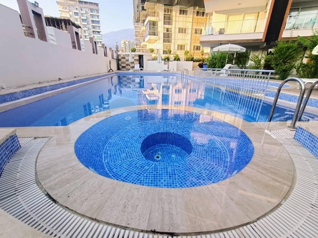 شقة غرفة وصالة مفروشة - ضمن مجمع سكني انيق - في محمودلار / الانيا 