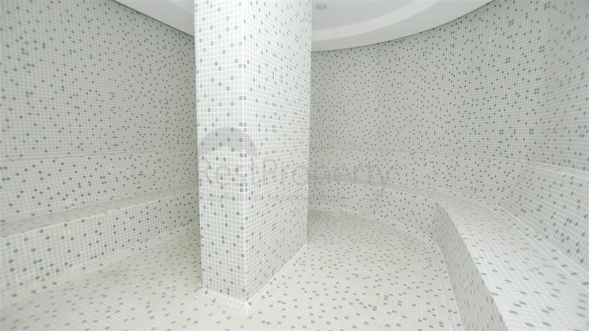 موقع مركزي - شقة غرفة وصالة مفروشة - ضمن مجمع سكني - في توسمور / الانيا 