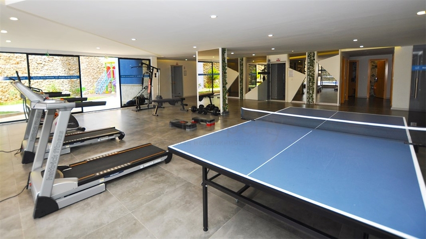 موقع مركزي - شقة غرفة وصالة مفروشة - ضمن مجمع سكني - في توسمور / الانيا 