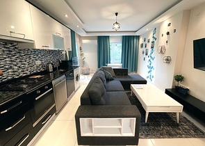 موقع مركزي - شقة غرفة وصالة مفروشة - ضمن مجمع سكني - في توسمور / الانيا 