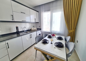 شقة غرفة وصالة - ضمن مجمع سكني جديد - في محمودلار / الانيا 