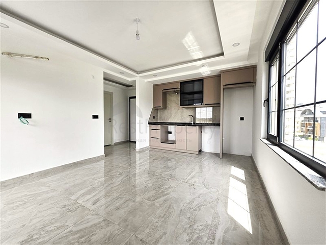 شقة مريحة 1 + 1 في مجمع جديد مطل على البحر