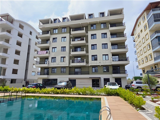 شقة مريحة 1 + 1 في مجمع جديد مطل على البحر