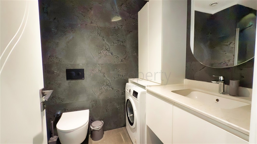 شقة 1+1 على البحر في منطقة كارجيجاك الخلابة هي عرض مثالي للعيش والاسترخاء