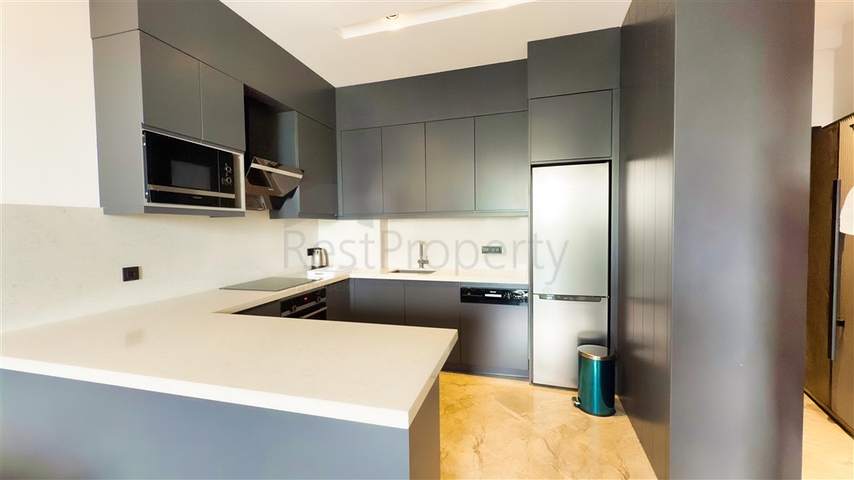 شقة 1+1 على البحر في منطقة كارجيجاك الخلابة هي عرض مثالي للعيش والاسترخاء