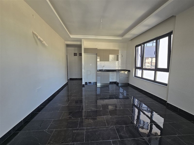 شقة 1+1 مطلة على البحر وبنية تحتية غنية في محمودلار